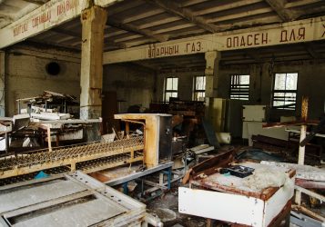 Carbon monoxide sign in russian at abadoned plant factory in Chernobyl town.