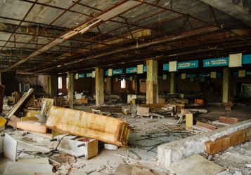 Supermarket shop at Chernobyl exclusion zone with ruins of abandoned pripyat city zone of radioactivity ghost town.